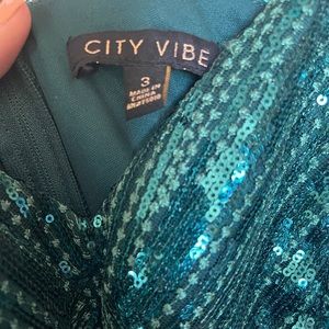 Gorgeous emerald green sequin dress with a v-neck line. Brand new with tags.